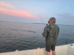 Scenic sunset catch photo from a Stripers Inc. Lake Texoma striper trip.