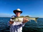 Client catch photo on Lake Texoma with Stripers Inc. guides.