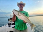 Guide and client catch portrait from Stripers Inc. on Lake Texoma.